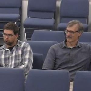 Rhett Lamb (right) listens with Code Enforcement Officer Wyatt Philbrook as Lamb’s retirement is announced.