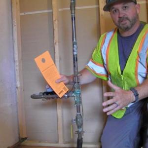 Maine Water employee Mickey Hall completes a home service line inspection in June 2024. (Photo courtesy Maine Water)