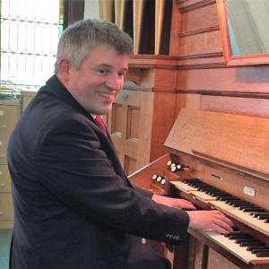Sean Fleming performing on the 1906 EW Lane tracker action pipe organ at the First Congregational Church of Searsport. (Photo courtesy Sean Fleming)